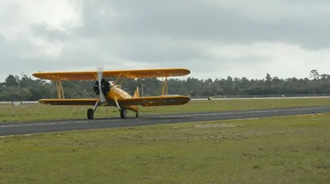 Retro biplane on an airfield Stock Footage 10847439