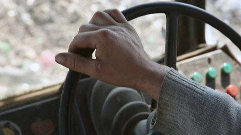 Retro bulldozer working. Close-up hands and steering wheel Stockbeeldmateriaal 76223298