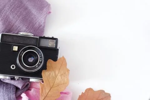 Retro camera and empty old instant paper photo album on wood table with maple Stock Photos