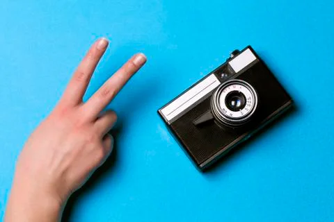 Retro camera and hand Stock Photos