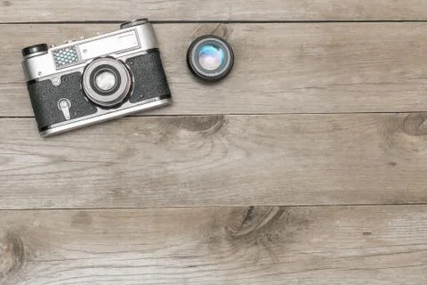 Retro camera lying on the aged boards Fotos Stock