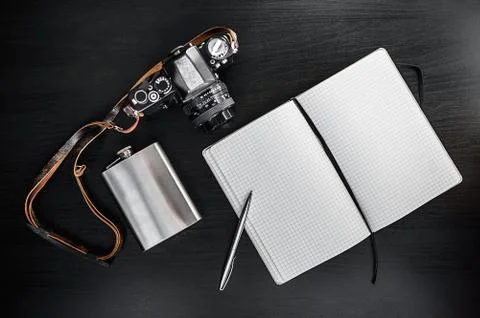 Retro Camera With Notebook On Dark Background Foto stock