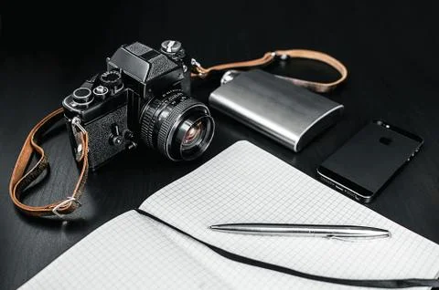 Retro Camera With Notebook On Dark Background Foto stock