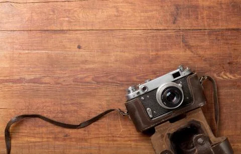 Retro camera on wood table background Stock Photos
