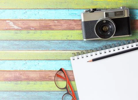 Retro camera on wood table background Stock Photos