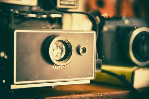 Retro camera on wood table background. Vintage camera. Film cameras that had Stock Photos