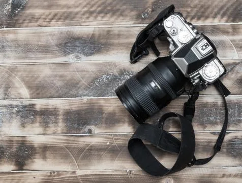 Retro camera on wood table background, vintage color tone Stock Photos