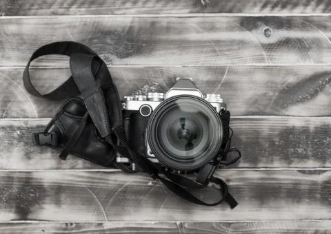 Retro camera on wood table background, vintage color tone Stock Photos