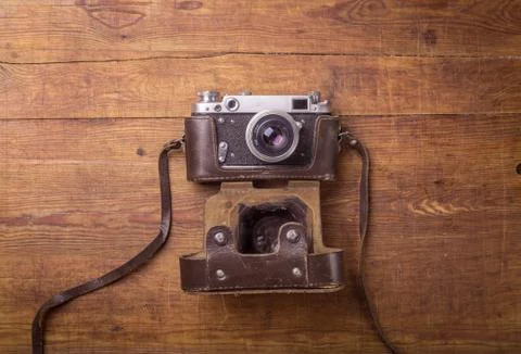 Retro camera on wood table Stock Photos