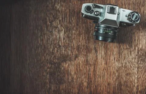Retro camera on wooden table Stock Photos