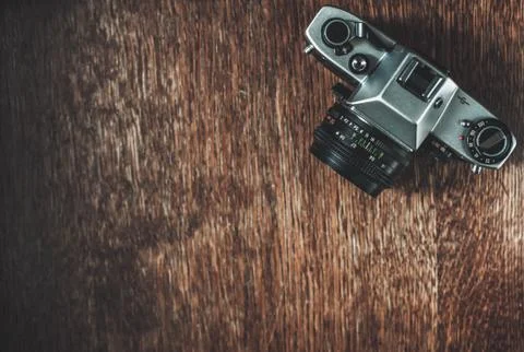 Retro camera on wooden table Stock Photos
