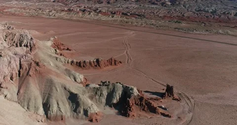 Retro camper parked in a remote area near Goblin Valley State Park, Utah, drone Stock Footage 167362372
