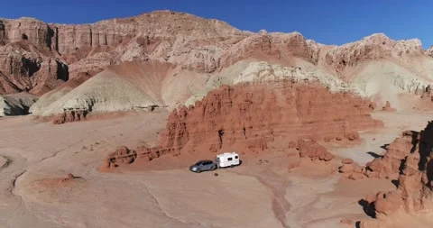 Retro camper parked in a remote area near Goblin Valley State Park, Utah, drone Stock Footage 167362389