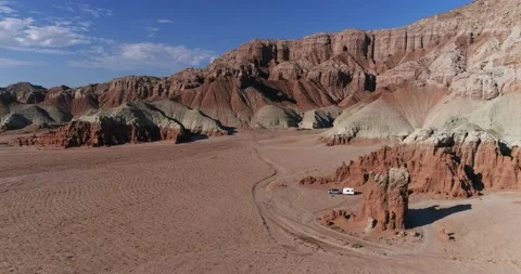 Retro camper parked in a remote area near Goblin Valley State Park, Utah, drone Stock Footage 167362410