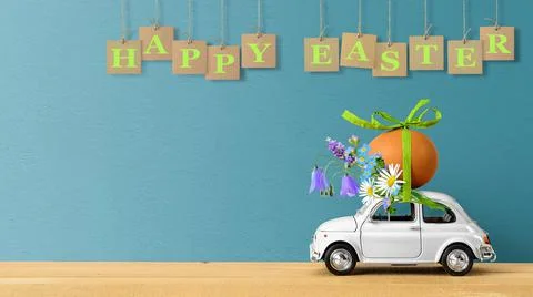 Retro car carrying an easter egg and bunch of flowers on the roof. Copy space Stock Photos