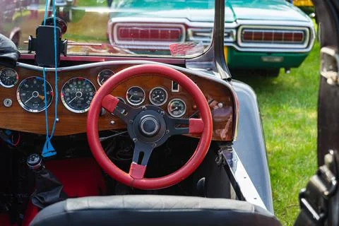 Retro car dashboard interior. View of the steering wheel and dashboard of an  Stock Photos
