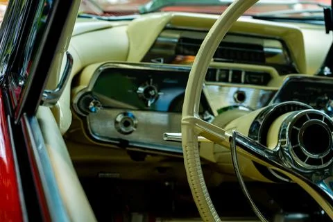 Retro car dashboard interior. View of the steering wheel and dashboard of an  Stock Photos