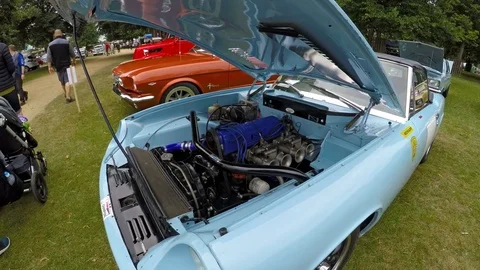 Retro car engine close up on a car auction in London, UK Stock Footage 79926958