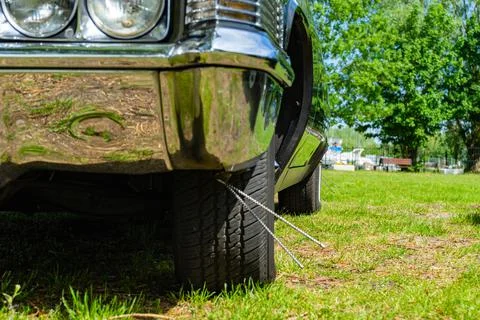 Retro car low angle view. View of the chrome bumper Stock Photos