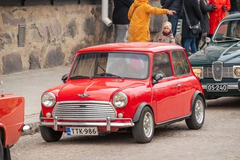 Retro car Mini drives down the street. Stock Photos