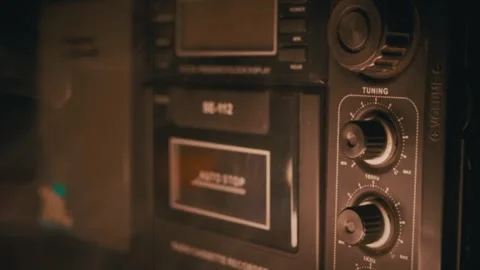 Retro Cassette Tape Recorder Enveloped in Smoke with Warm Light Stock Footage 338998270
