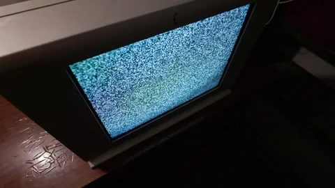 Retro Cathode Ray Tube Television Set Displaying Static Interference in Dimly Video stock 335634367