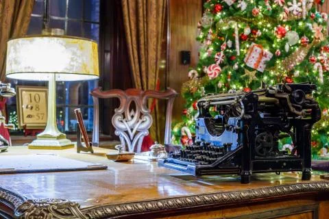 Retro Christmas interior with old typewriter Stock Photos