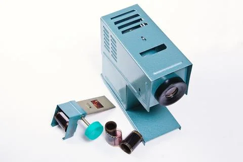 Retro cine-projector on the white background. Stock Photos
