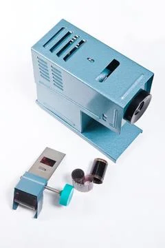 Retro cine-projector on the white background. Stock Photos
