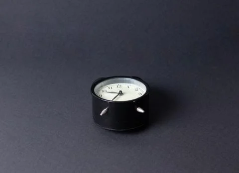 Retro clock on black background Stock Photos