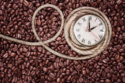 Retro clock on a coffee background Stock Photos