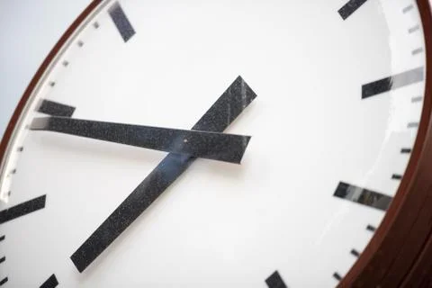 Retro clock face with two hands and no numbers. Stock Photos