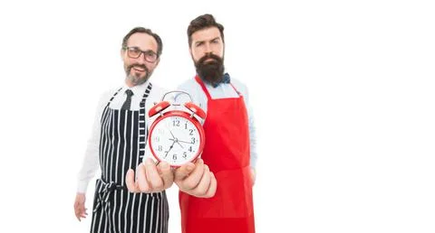 Retro clock in hands of men. lunch time. catering business. fast food. bearded Stock Photos