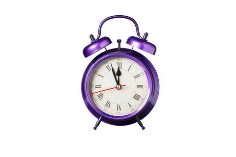 Retro clock, pointer clock, violet, purple color alarm clock on isolated whit 库存照片