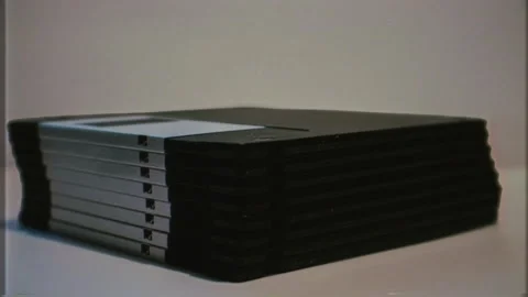 Retro Computer Diskettes Pile Vintage Technology Old VHS Effect Zoom In Stock Footage 268310553