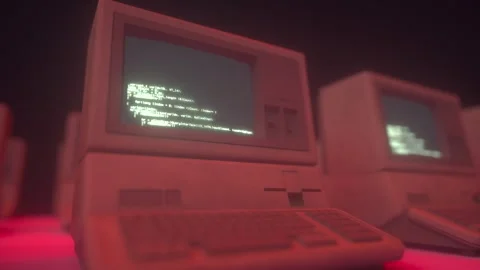 Retro Computer With Glowing Green Code Running in Infinite Loop Stock Footage 309055421