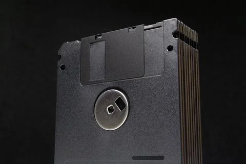 Retro computer storage with classic black floppy disks Foto stock