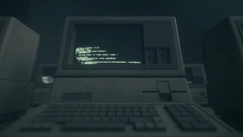Retro Computer Terminal With Glowing Code in Dark Cinematic Room Stock Footage 333857697