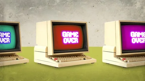 Retro Computers Showing Game Over on Colorful Screens Stock Footage 346783291