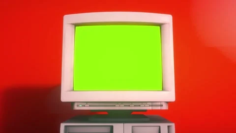 Retro Desktop Computer With Green Screen on Vibrant Red Background Stock Footage 343886408