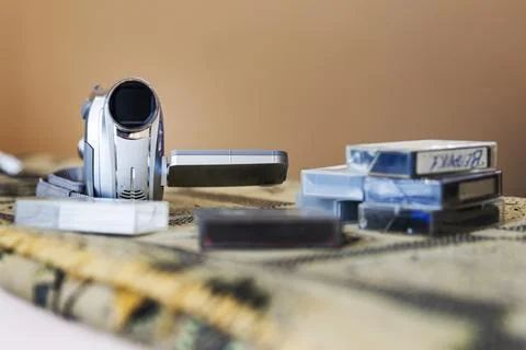 Retro Digital Camcorder with a Stack of MiniDV Cassettes Foto stock