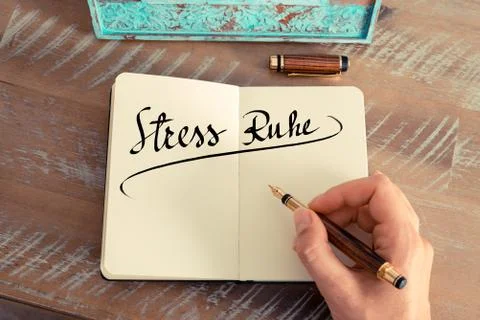 Retro effect and toned image of woman hand writing a note on a notebook. Hand Stock Photos