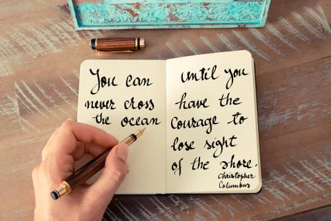 Retro effect and toned image of a woman hand writing on a notebook. Handwritt Stock Photos