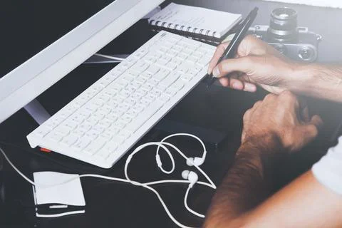 Retro effect toned image of a graphic designer working with digital tablet pe Stock Photos