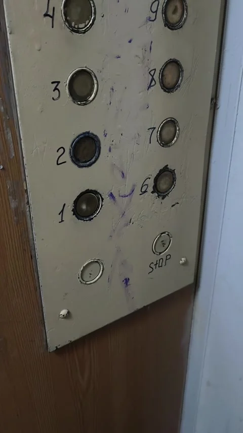 Retro Elevator Panel with Worn Buttons and Graffiti Stock Footage 315230407