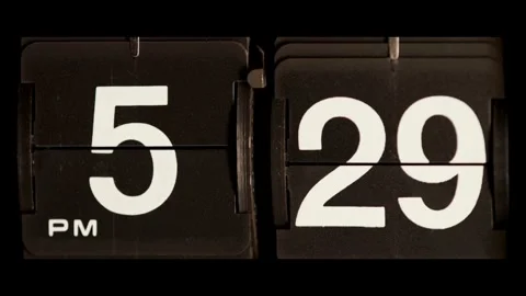 Retro flip clock changes from five twenty nine pm Stock Footage 329667725