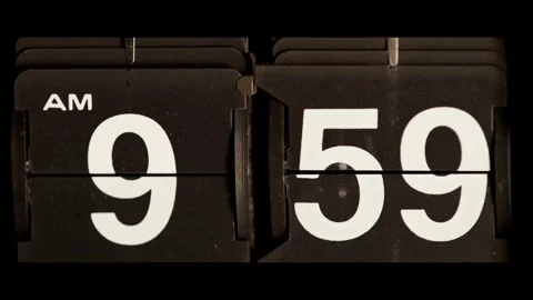 Retro flip clock changes time to ten o clock Stock Footage 329673796