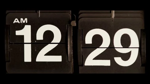 Retro flip clock changes from twelve twenty nine morning Stock Footage 329673765