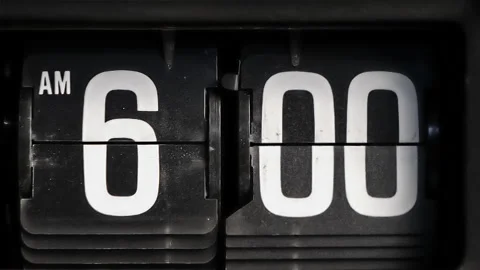 Retro flip clock changing from 5:59am to 6:00am on a Monday morning Stock Footage 145818876