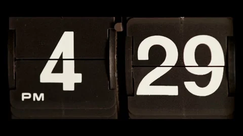 Retro flip clock changing from four twenty nine pm Stock Footage 329667696